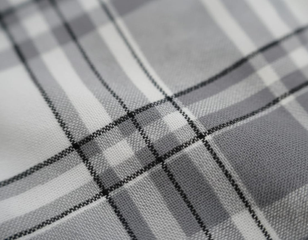Close-up of a textured gray fabric with a subtle pattern