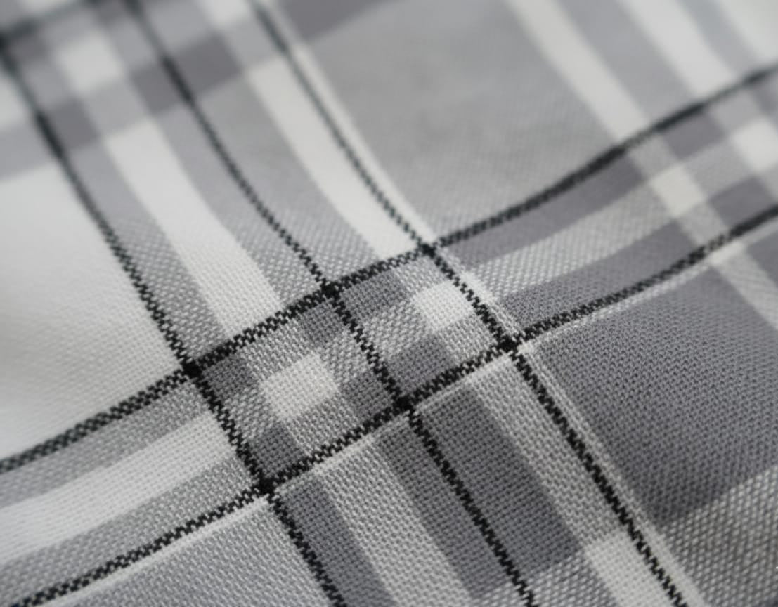 Close-up of a textured gray fabric with a subtle pattern