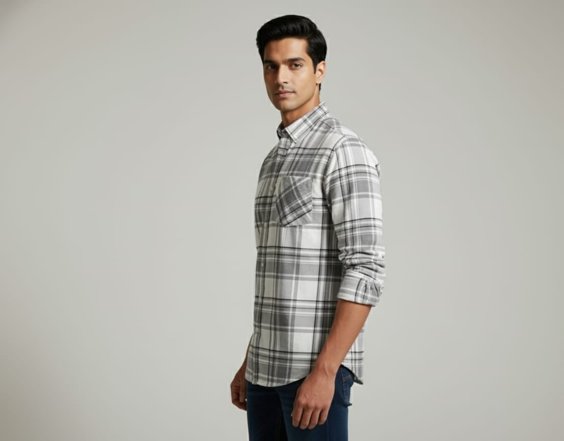 Man wearing a plaid shirt on a gray background