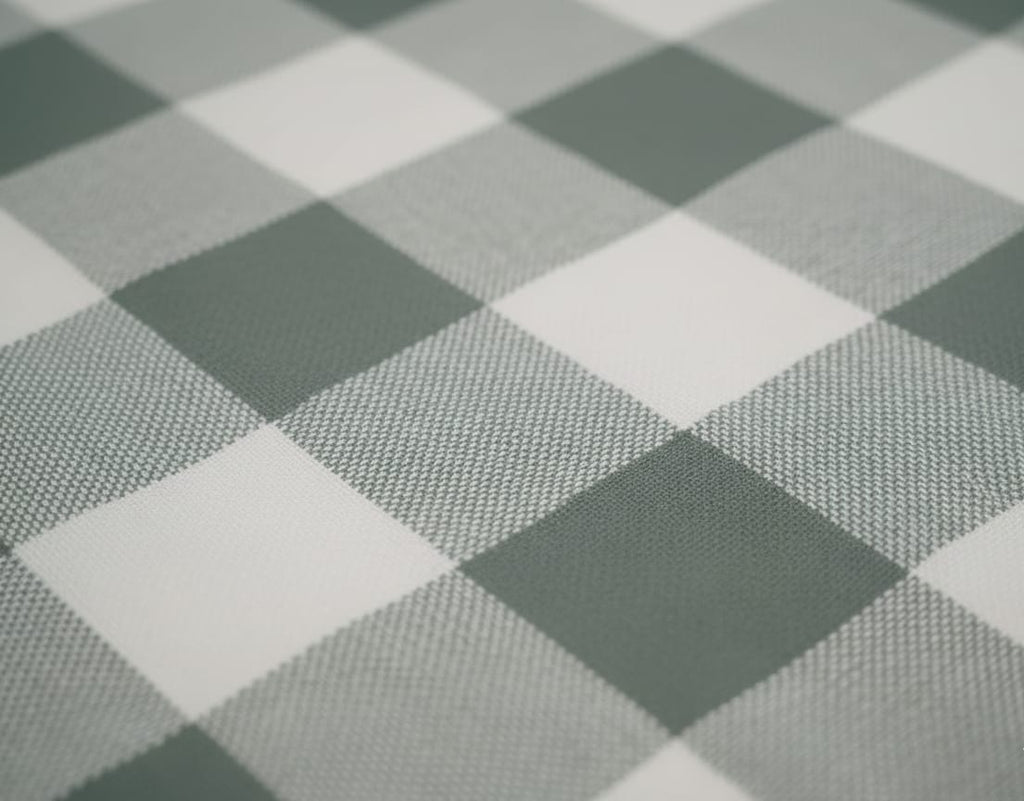 Close-up of a checkered pattern with alternating dark and light squares.