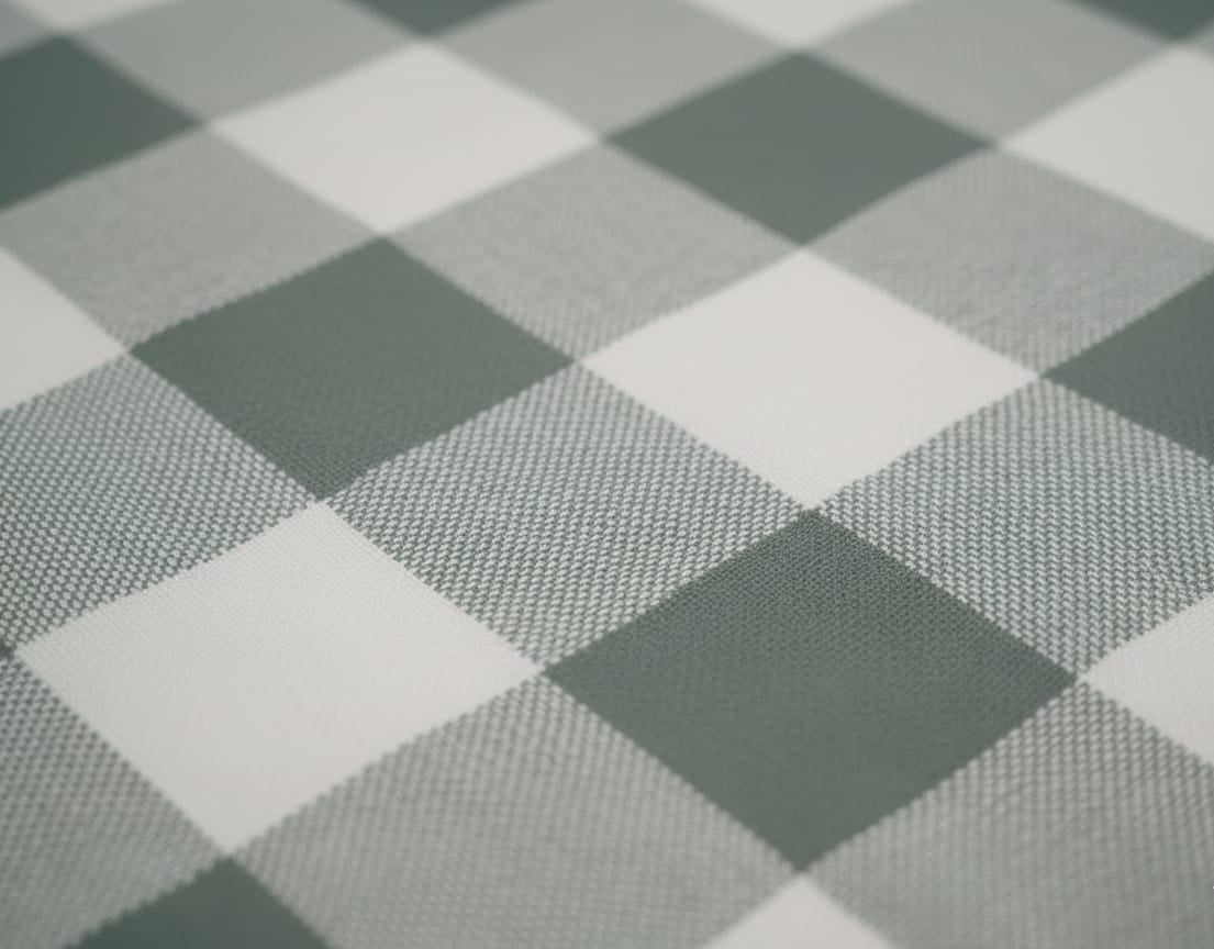 Close-up of a checkered pattern with alternating dark and light squares.