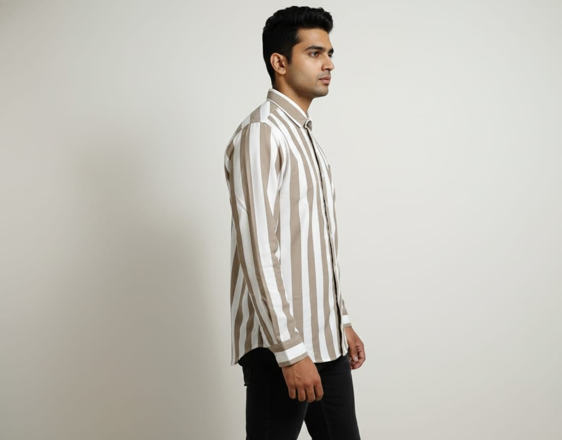 Man wearing a striped shirt against a plain background