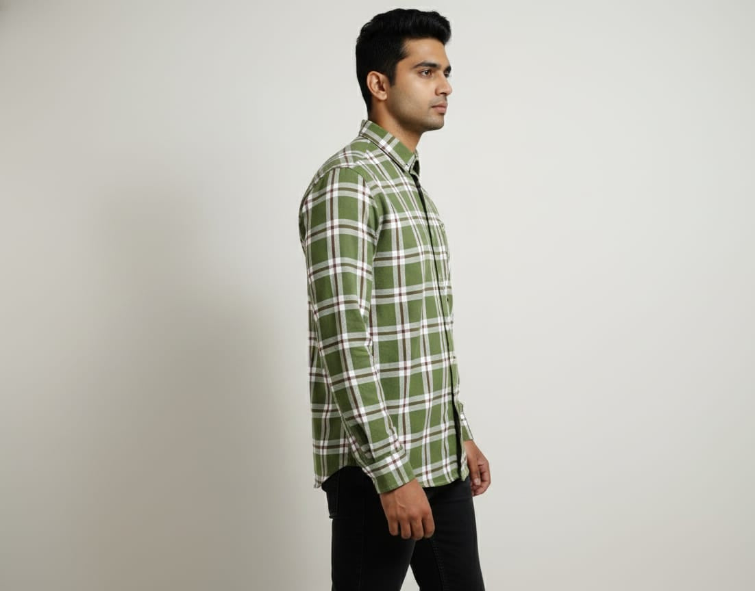Man wearing a green plaid shirt against a plain background