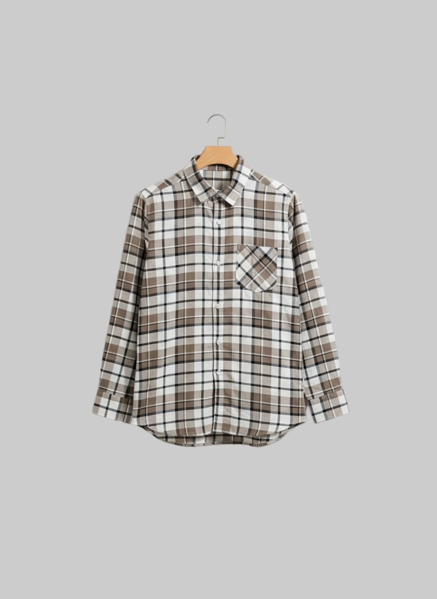 Plaid shirt on a hanger against a white background